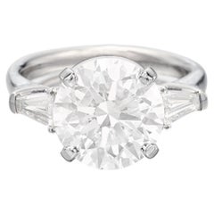 GIA Certifield 5 Carat Round Brilliant Cut Diamond Ring with tapered baguette