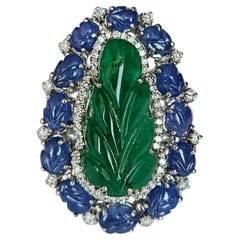 Set in 18K Gold, carved Zambian Emerald, Blue Sapphires & Diamonds Cocktail Ring