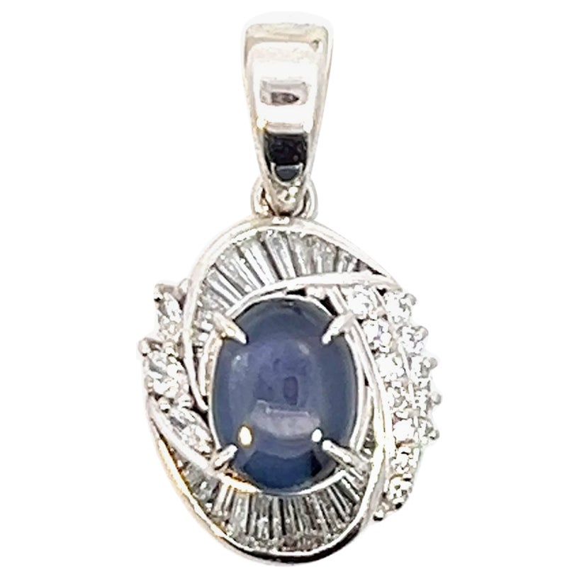 Platinum 4.35 crt Blue Star Sapphire. with .95 crt Diamond Pendant