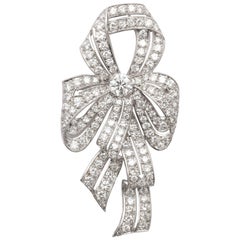 1930s Diamond Platinum Naturalistic Bow Pin