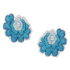 Boucles d'oreilles en or 18 carats, titane, diamants et topaze bleue