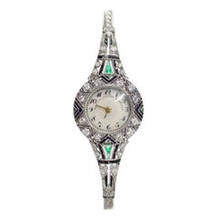 Important Art Deco Black, Starr, and Frost Platinum Diamond Emerald Wristwatch