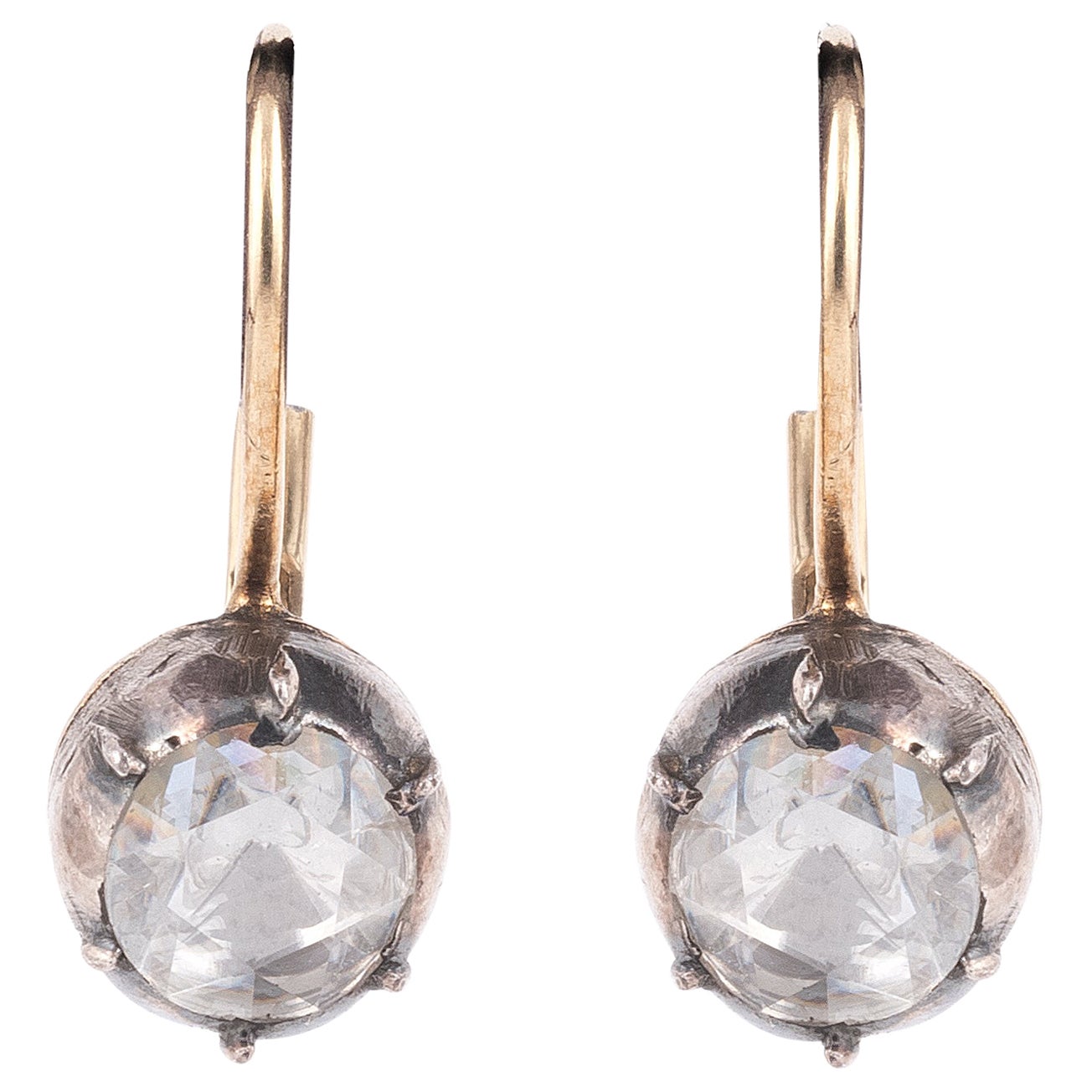 Silver and 18kt yellow gold with collet set foiled back rose-cut diamonds pair of earrings.
Gross weight : 3,21 gr. (pierced ears system)
Diamond diameter : 5,20 (0,50carat each approx.). 
