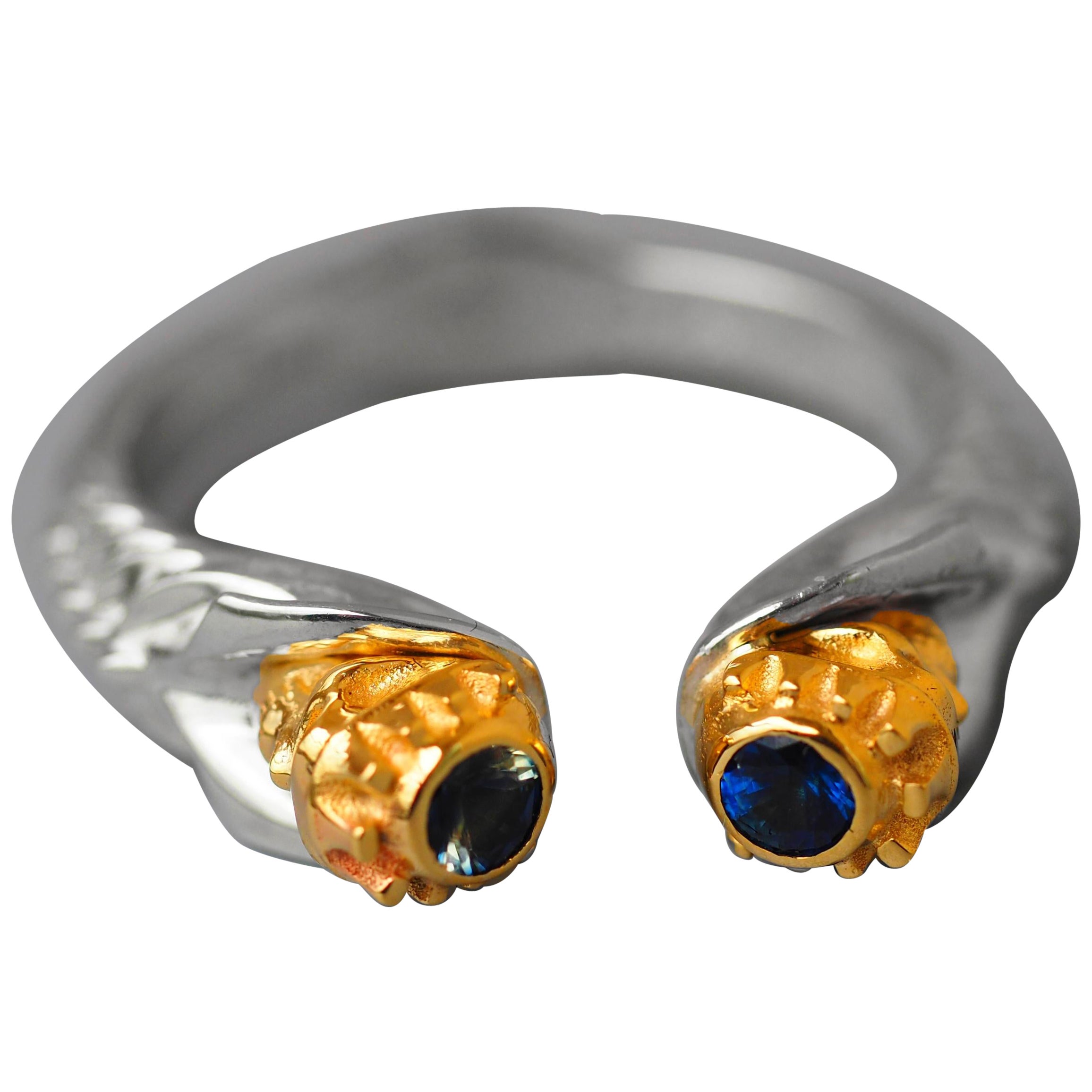 Skull ring with blue sapphires.  For Sale
