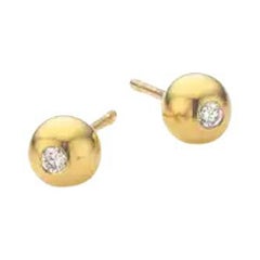 Clous d'oreilles en or jaune cabré avec 2 diamants de 0,05 carat