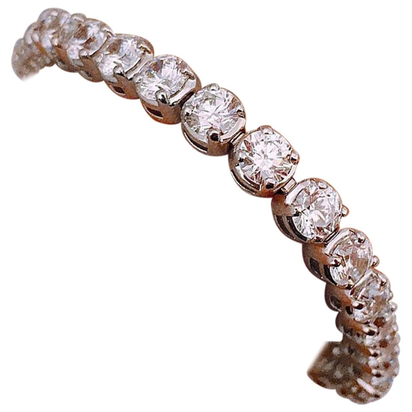 Each diamond was hand picked first and foremost to have a strong fiery rainbow which is the most important effect of a bracelet! 
Color: E-F 
Clarity: Vs2
Cut: Excellent  
This Bracelet was designed and manufactured by Emilio! 7 inches long, and can