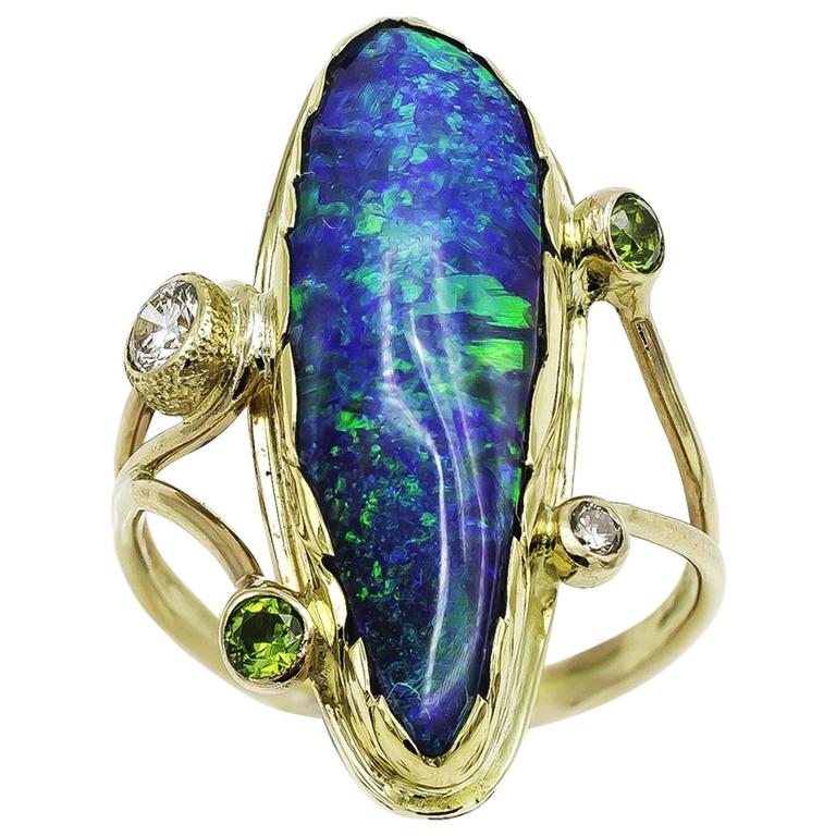 Large Boulder Opal Ring with Green Garnets and White Sapphires set in ...