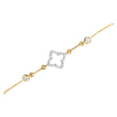 14 Karat Gelbgold Quatrefoil-Armband mit 0,16 Karat Diamanten