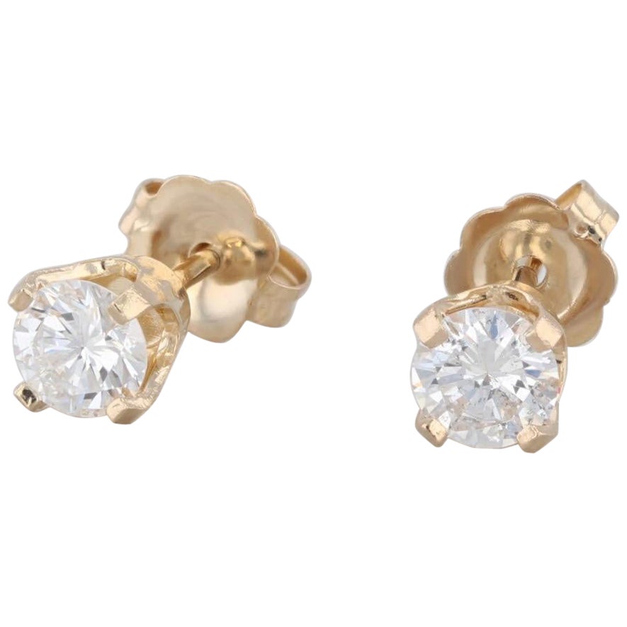 Clous d'oreilles solitaires en or jaune 14 carats avec diamants ronds de 0,50 carat en vente