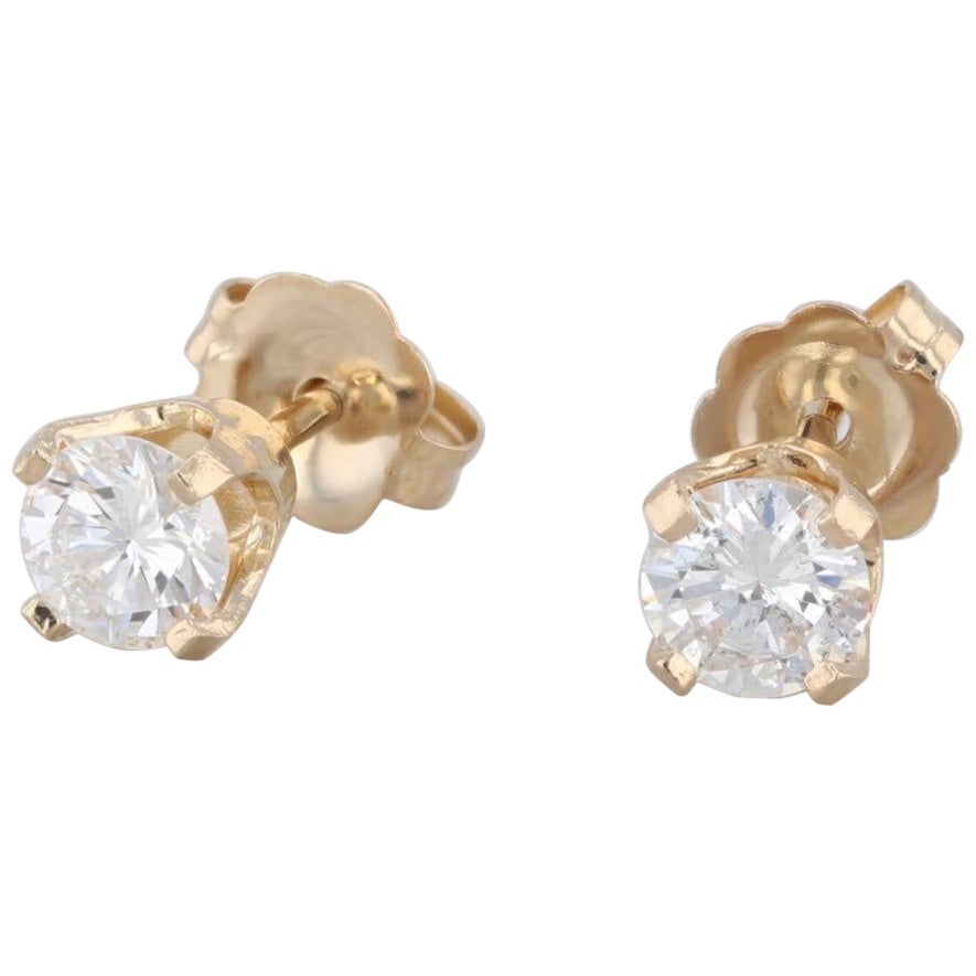 Clous d'oreilles solitaires en or jaune 14 carats avec diamants ronds de 0,50 carat