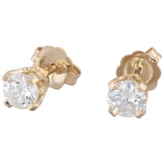 Clous d'oreilles solitaires en or jaune 14 carats avec diamants ronds de 0,50 carat