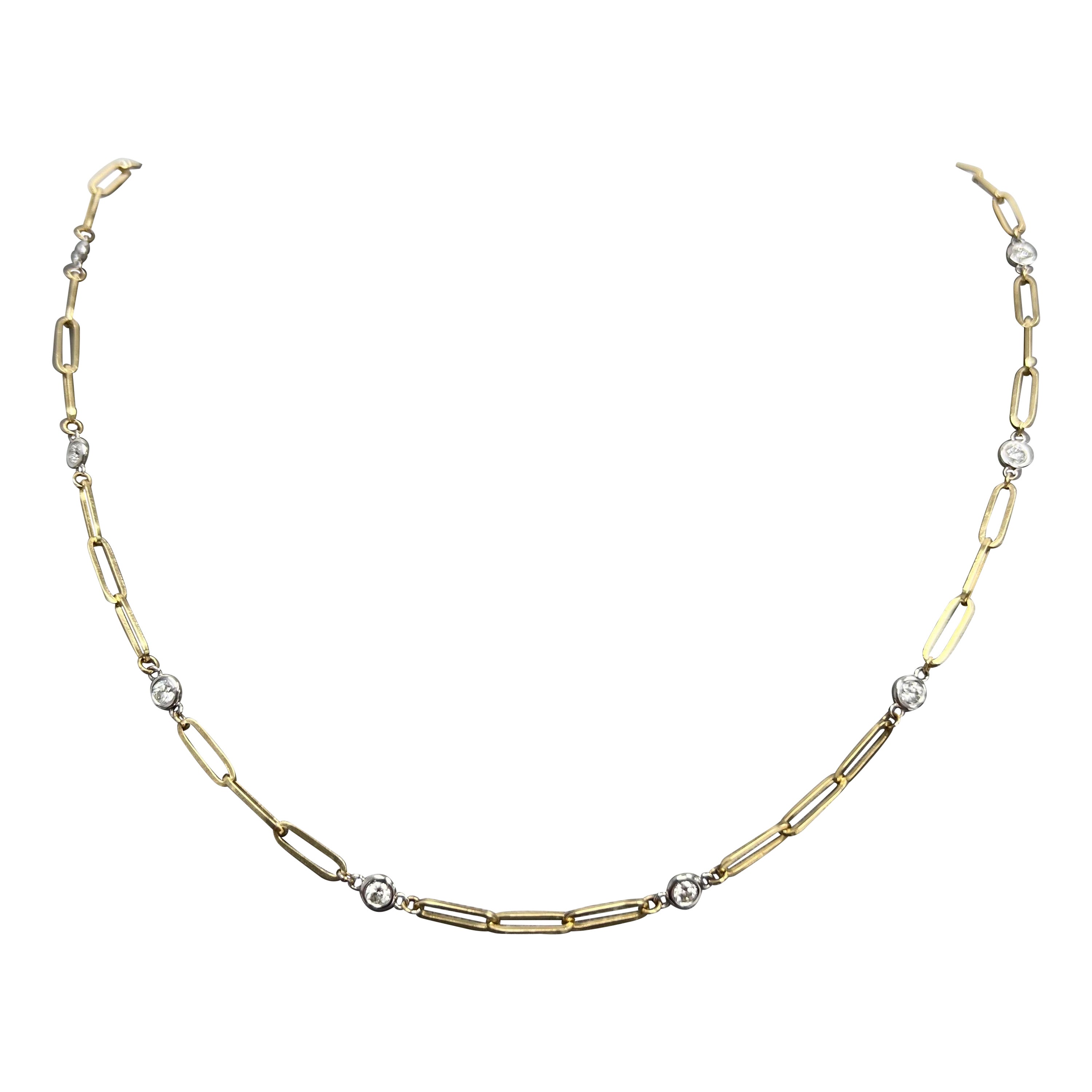 Indulge in the epitome of elegance with this exquisite Diamonds-by-the-Yard and Paper Clip Chain Gold Necklace, a harmonious fusion of opulence and modernity. Crafted in 14k yellow and white gold, this versatile piece exudes a timeless charm that