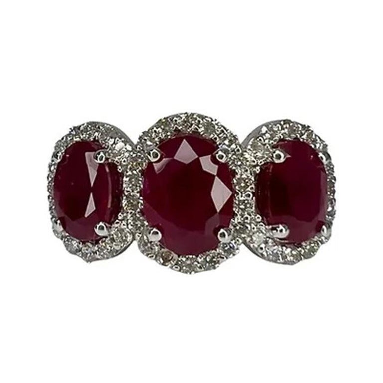 3.30 Carat Ruby Three Stone Halo Ring For Sale