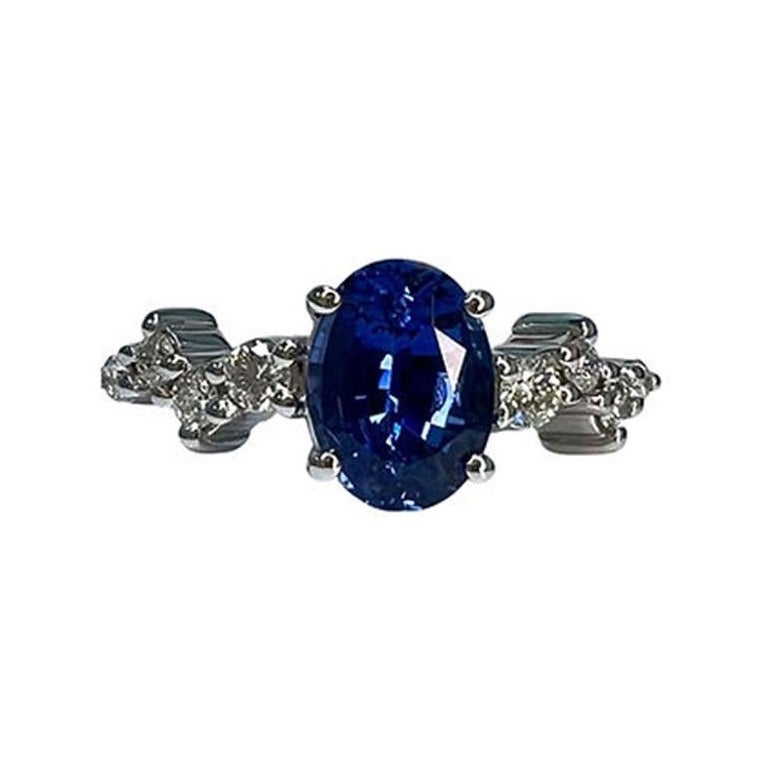 1.7 Carat Sapphire Oval Cluster Ring For Sale