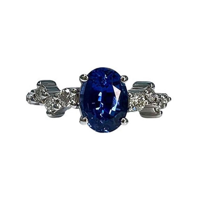 1.7 Carat Sapphire Oval Cluster Ring For Sale