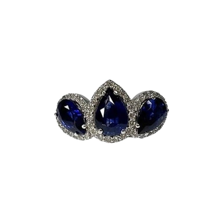 2.8 Carat Sapphire Pear Three Stone Halo Ring For Sale