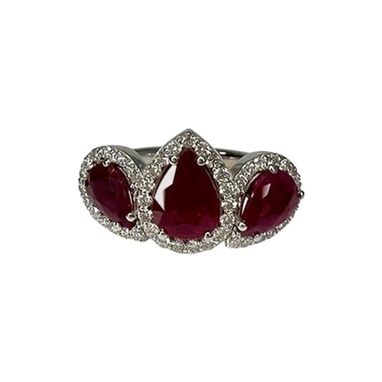 3 Carat Ruby Three Stone Halo Ring For Sale