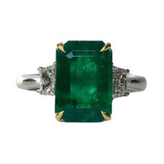 3.87 Carat Emerald EC Three Stone Ring