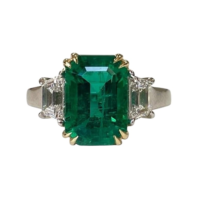 3.52 Carat Emerald Three Stone Ring For Sale