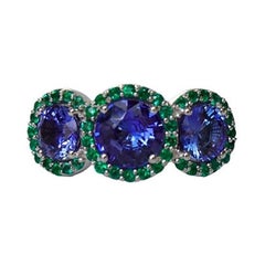3.23 Carat Sapphire Three Stone Ring with Emerald Halo