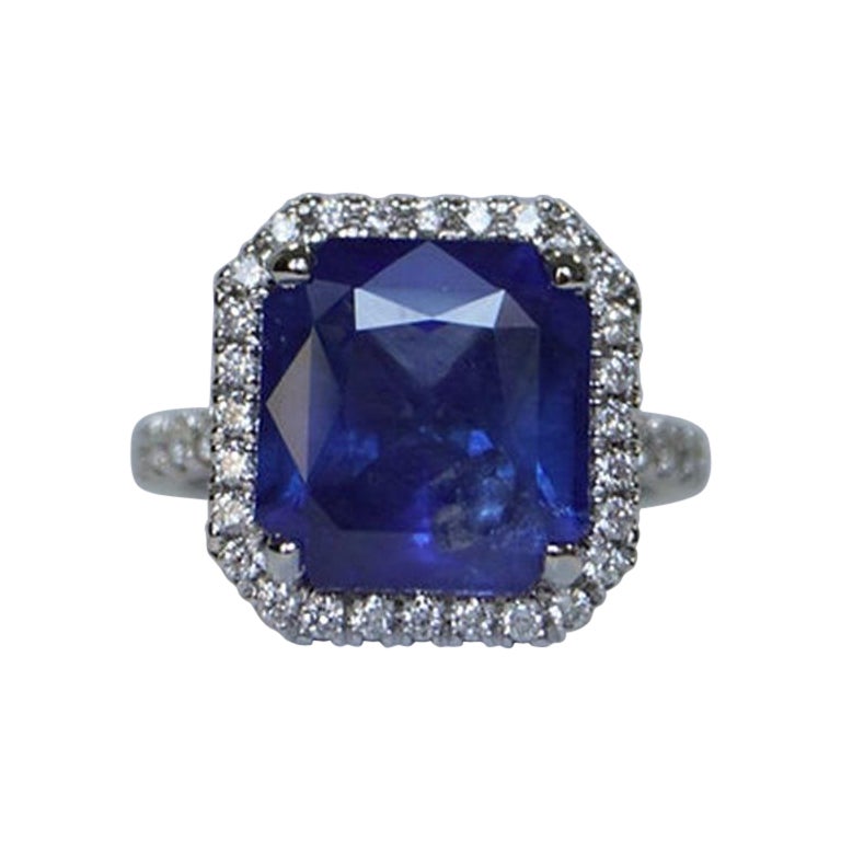 9 Carat Sapphire Emerald-Cut Halo Ring For Sale