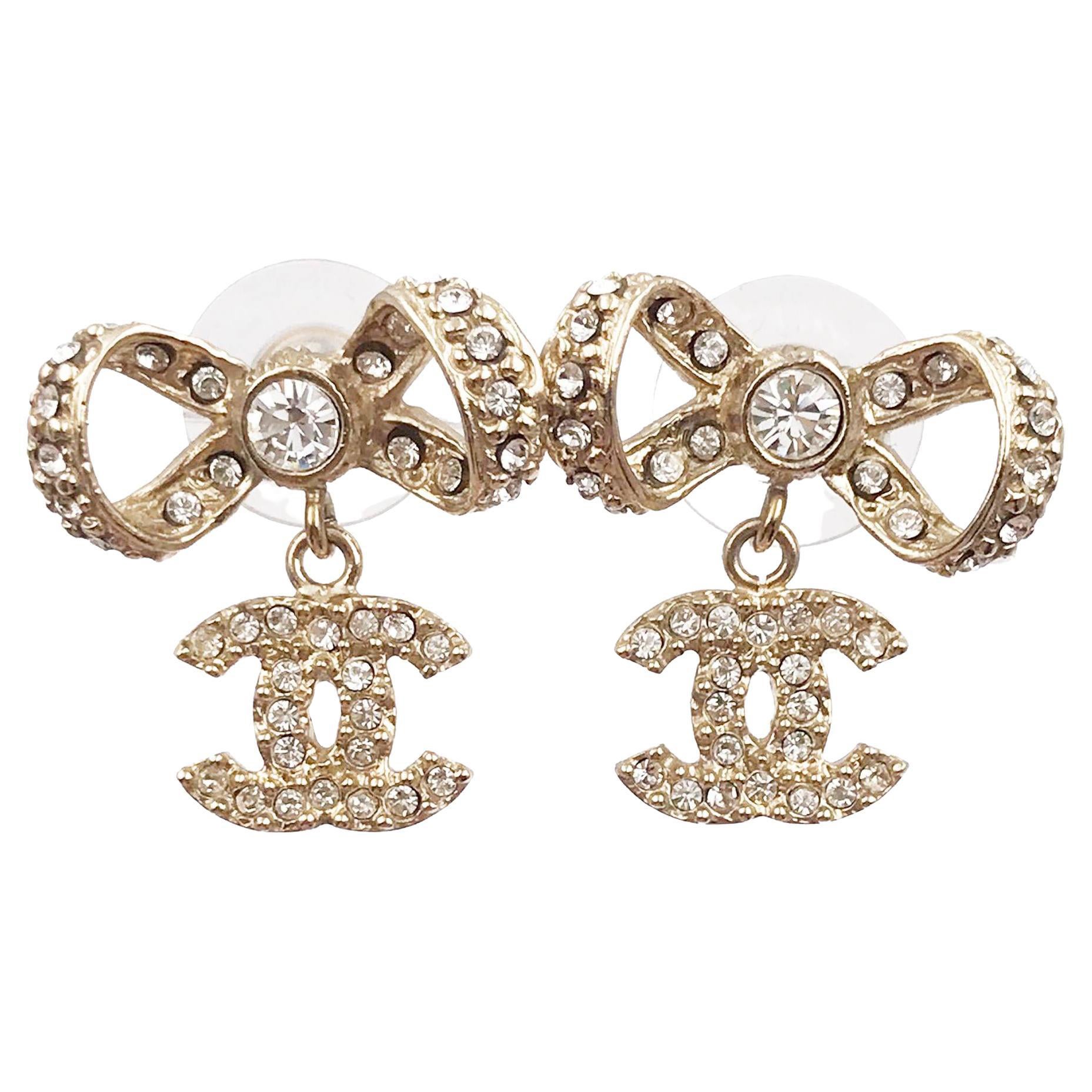 Chanel Classic Light Gold Ribbon Bow CC Crystal Piercing Earrings For Sale
