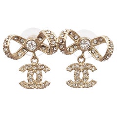 Chanel Classic Light Gold Ribbon Bow CC Crystal Piercing Earrings