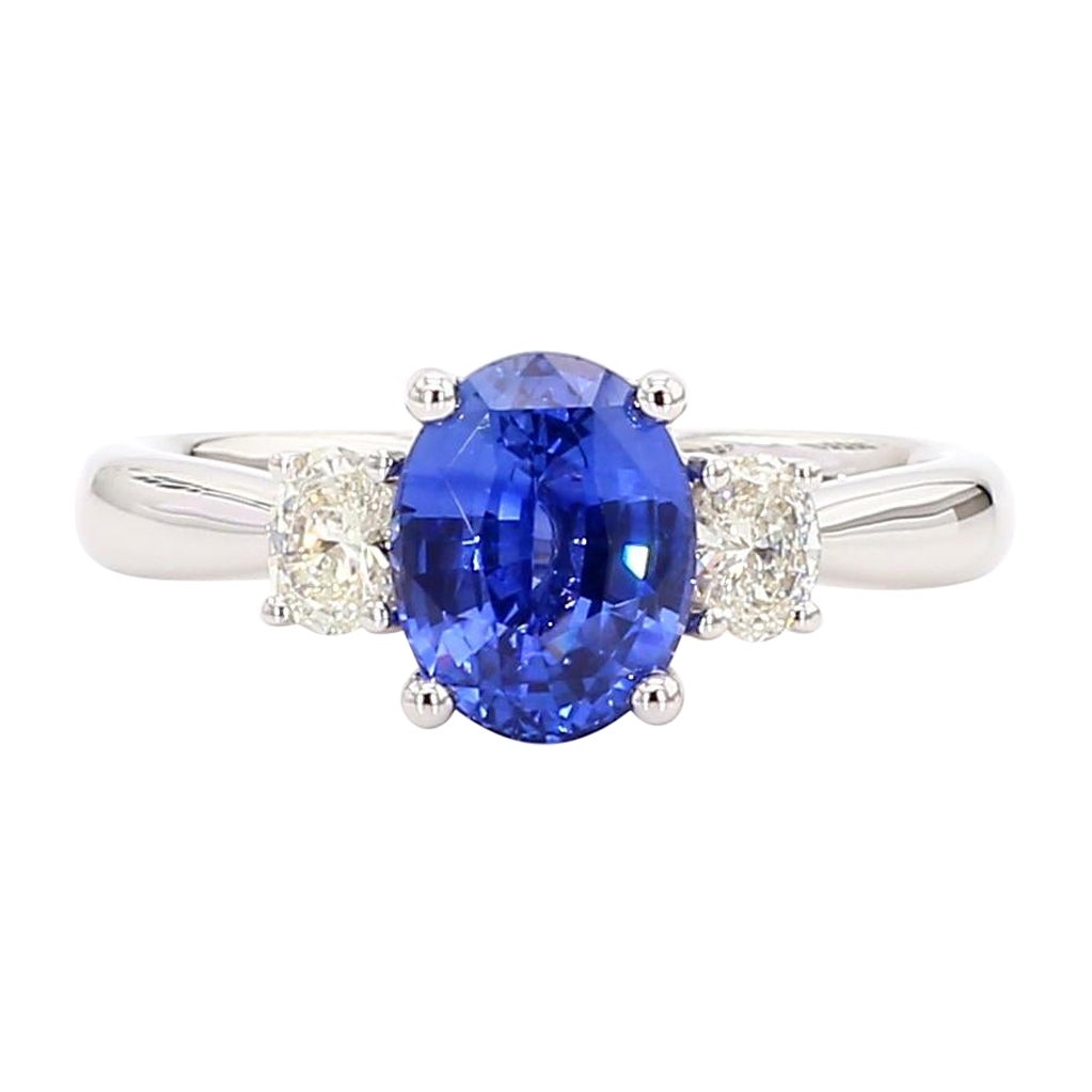 Natural Blue Oval Sapphire and White Diamond 2.37 Carat TW Gold Cocktail Ring For Sale