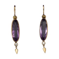 Vintage gold earrings with amethysts and diamonds.