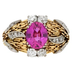 Pink sapphire and diamond cluster ring. 