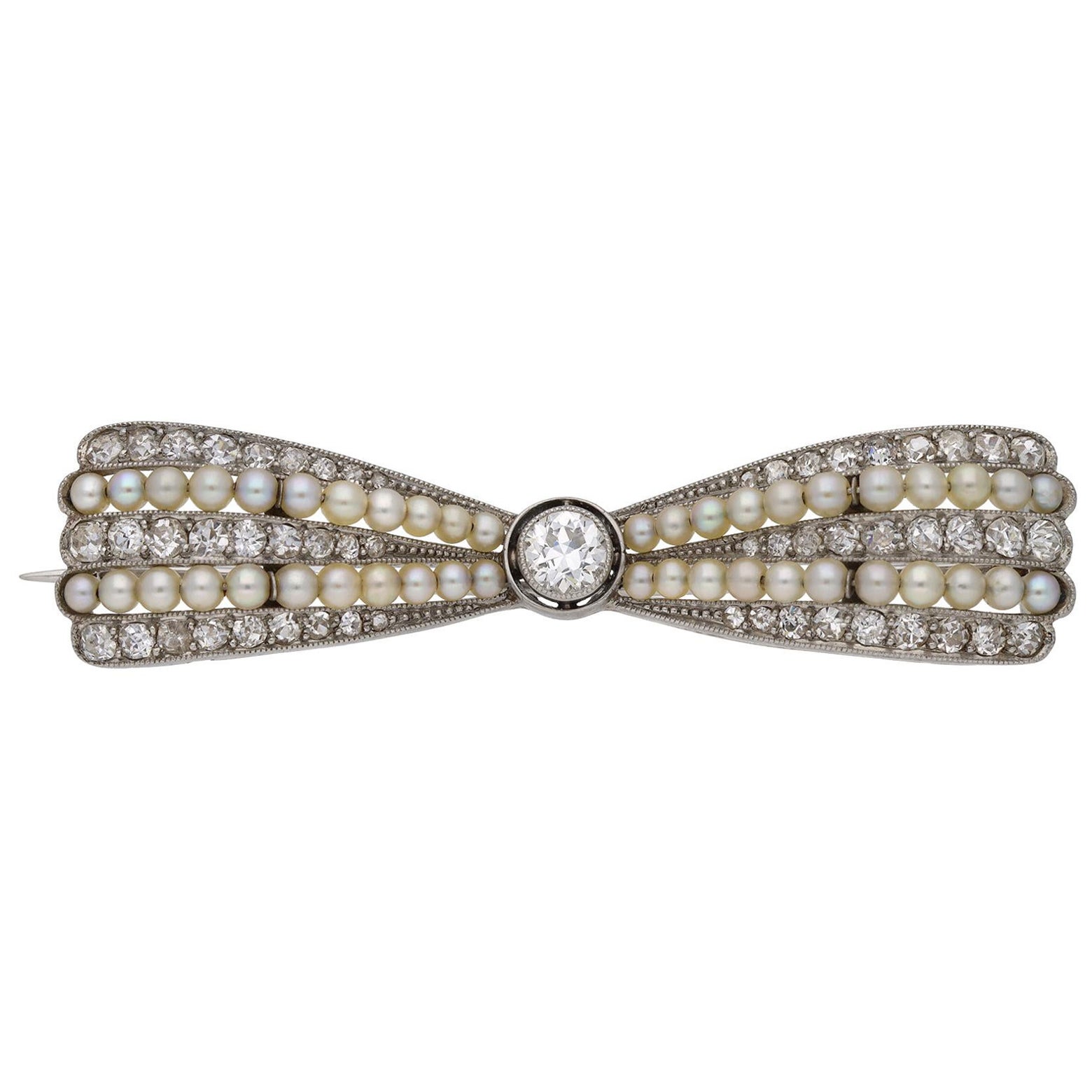 Antique pearl and diamond bow brooch, circa 1905. For Sale