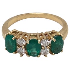 Emerald Diamond Three Stone Yellow Gold Ring