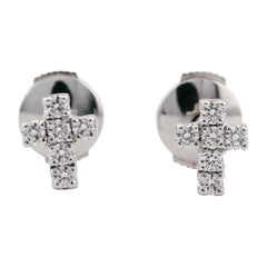 Diamant de Cartier  Clous d'oreilles croix en or blanc 18 carats