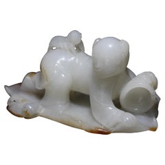 Antique A White and Russet Jade Carving of a Boy Catching Crickets, Qing Dynasty 