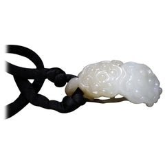 A Fine White and Russet Jade Carving of Two Lotus Seed Pods, Qing Dynasty