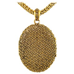 Relicario victoriano de oro y cadena