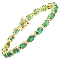 Oval Emerald and Diamond Patterned Gold Tennis Bracelet