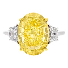 GIA Certified 5.66 Carat Fancy Yellow Oval Cut Platinum Ring with Half Moon