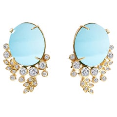 Pendientes Enredadera Syna de Oro Amarillo con Topacio Azul y Diamantes