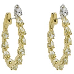 Orecchini a cerchio con diamante giallo a forma di pera