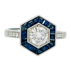 White Diamond and Blue Sapphire Ring in Platinum