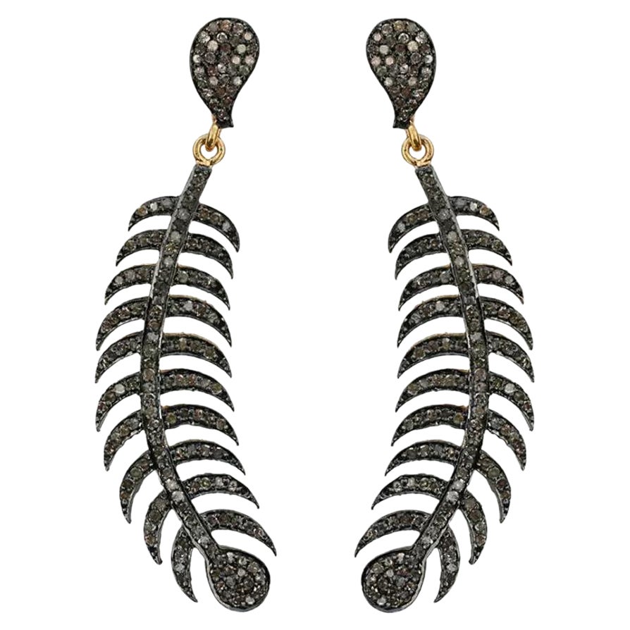 Boucles d'oreilles plumes en argent 925 et or 14k pavé de diamants