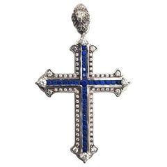 Cross diamonds sapphires 18 kt white gold