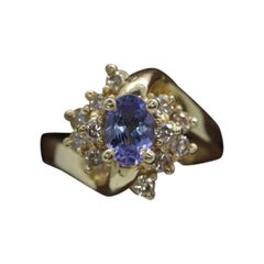 Tanzanite and diamond Cluster ring. 14k Blue Tanzanite and Diamond Halo Bypass