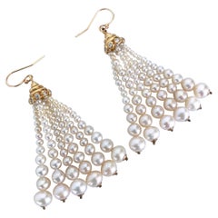 Marina J. Orecchini con nappe di perle graduate con diamanti e oro giallo massiccio 14k