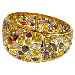 14k Yellow Gold Bangle with Mixed Colored Synthetic and Sapphire Stones