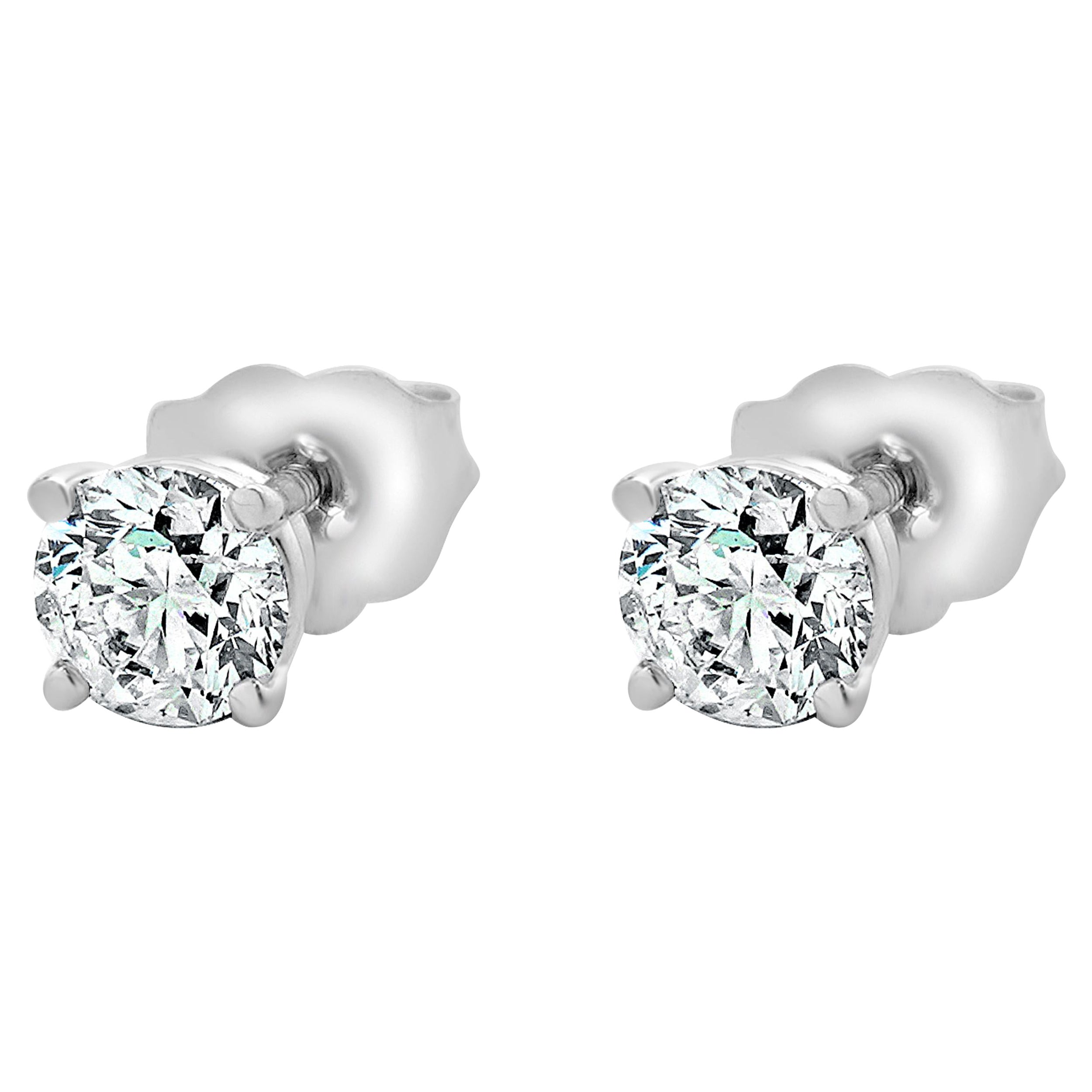 Clous d'oreilles en or blanc 14 carats avec diamants taille brillant rond