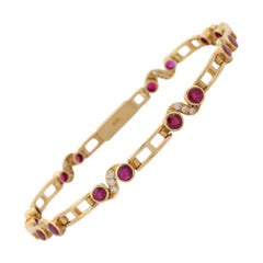 Pulsera de diseño de oro amarillo de 18 quilates con diamantes y rubíes