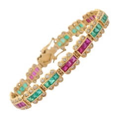 Armband aus 18 Karat Gelbgold mit Smaragd, Rubin und Diamanten