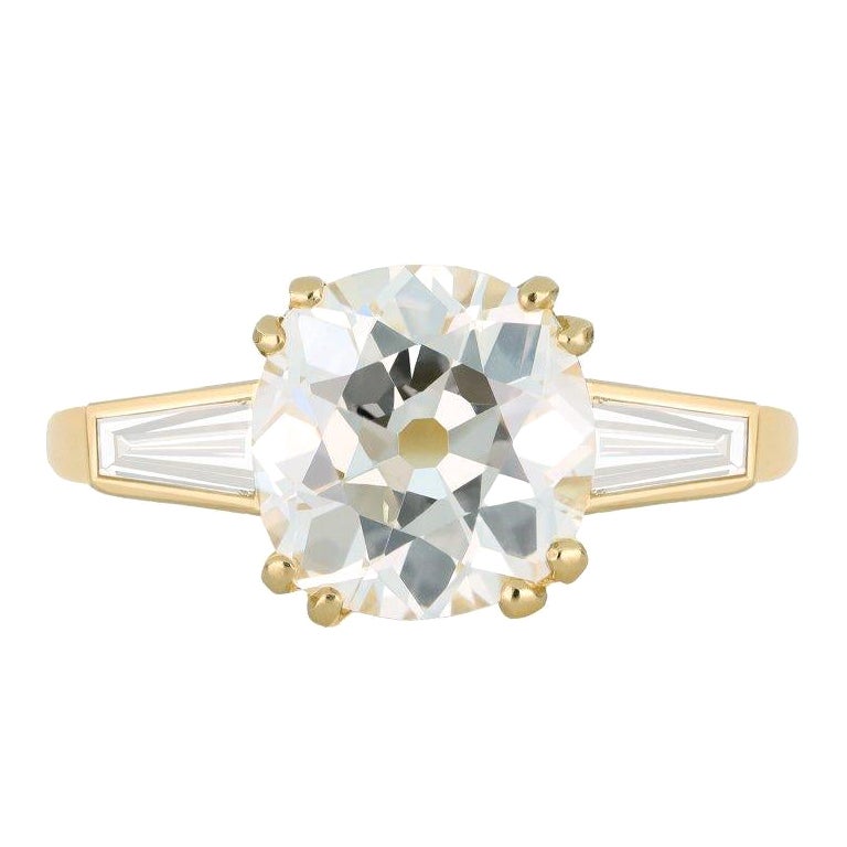 Old mine diamond flanked solitaire ring.